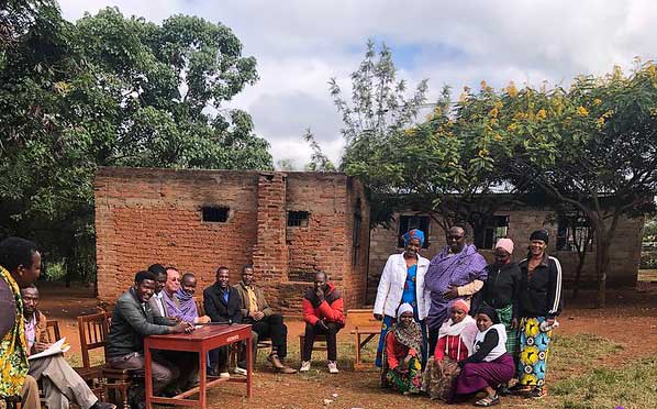desk donation ceremony with villagers