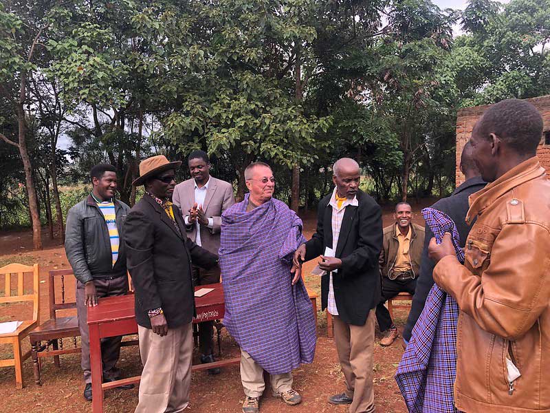 desk donation ceremony at nearby village