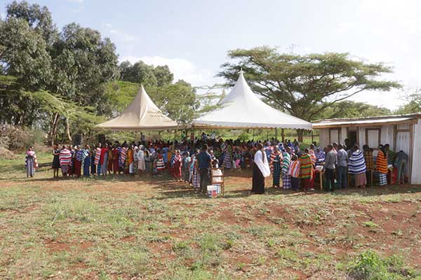 Tents set up on our new land provided shade for over 200 guests.