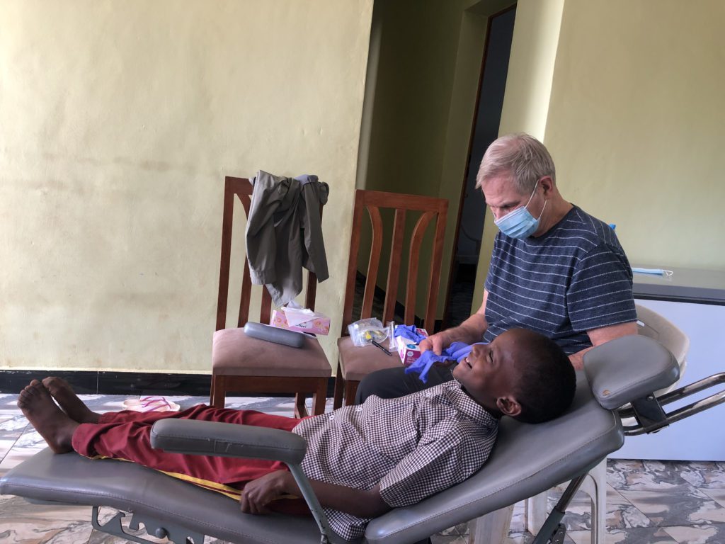 Volunteer retired dentist did dental checks