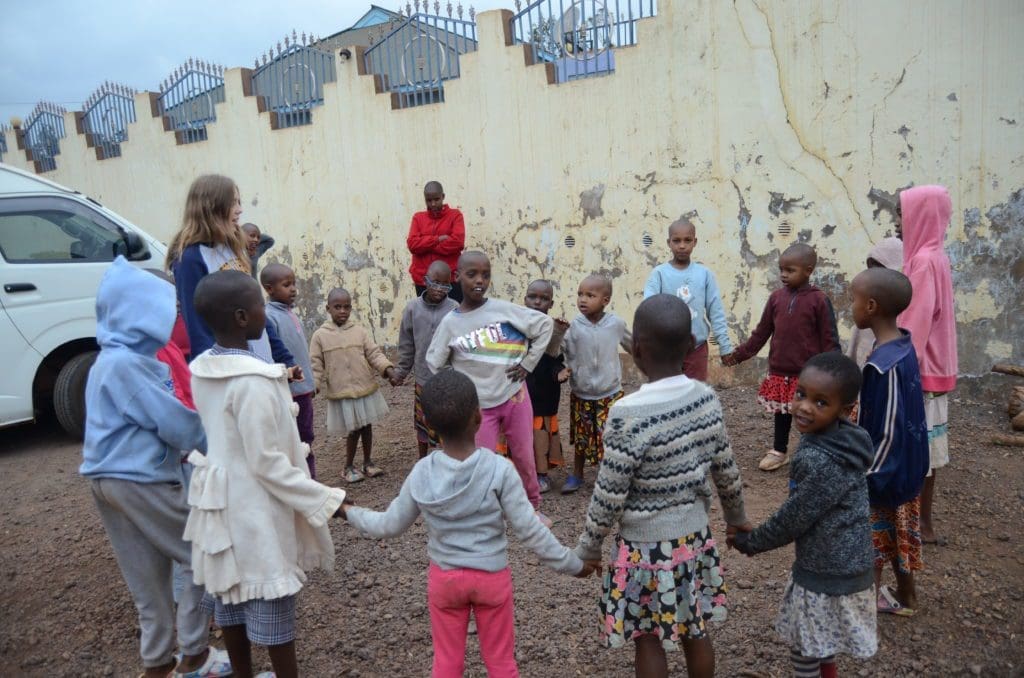 Girls enjoying a game in the courtyard during their school break.