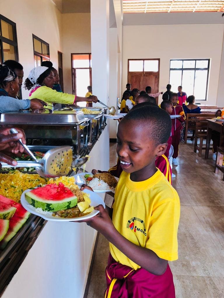 Joyce receiving her meal at the Christmas celebration.