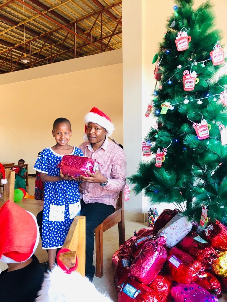 Sarah receiving her Christmas gift from Elisante or should we call him Eli-SANTA? 