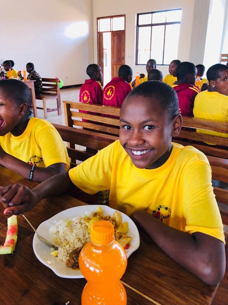 Suzana enjoying her meal at the Christmas party.