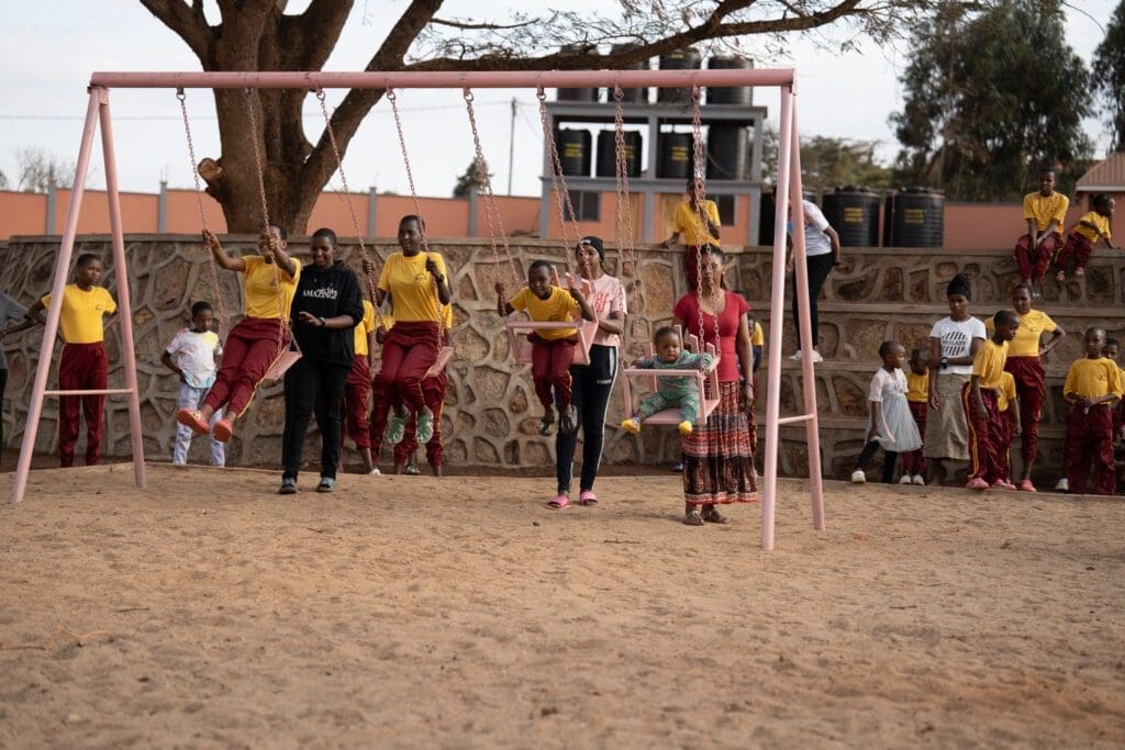 girls playing on swingset