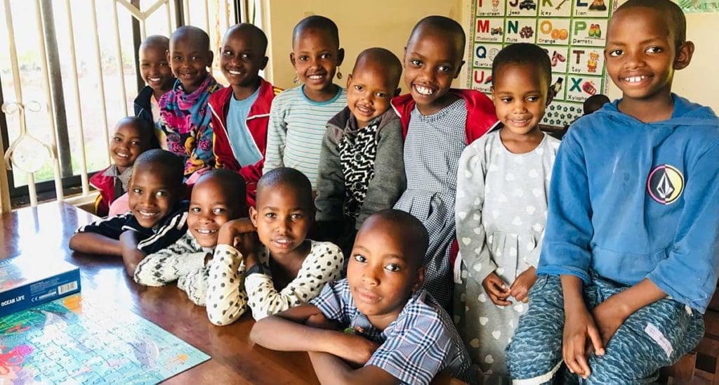 group photo of maasai girls in their classroom