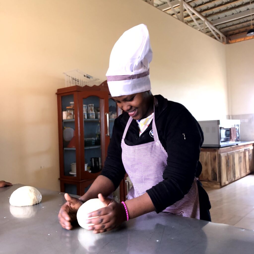 Nemoipo learning to make bread.