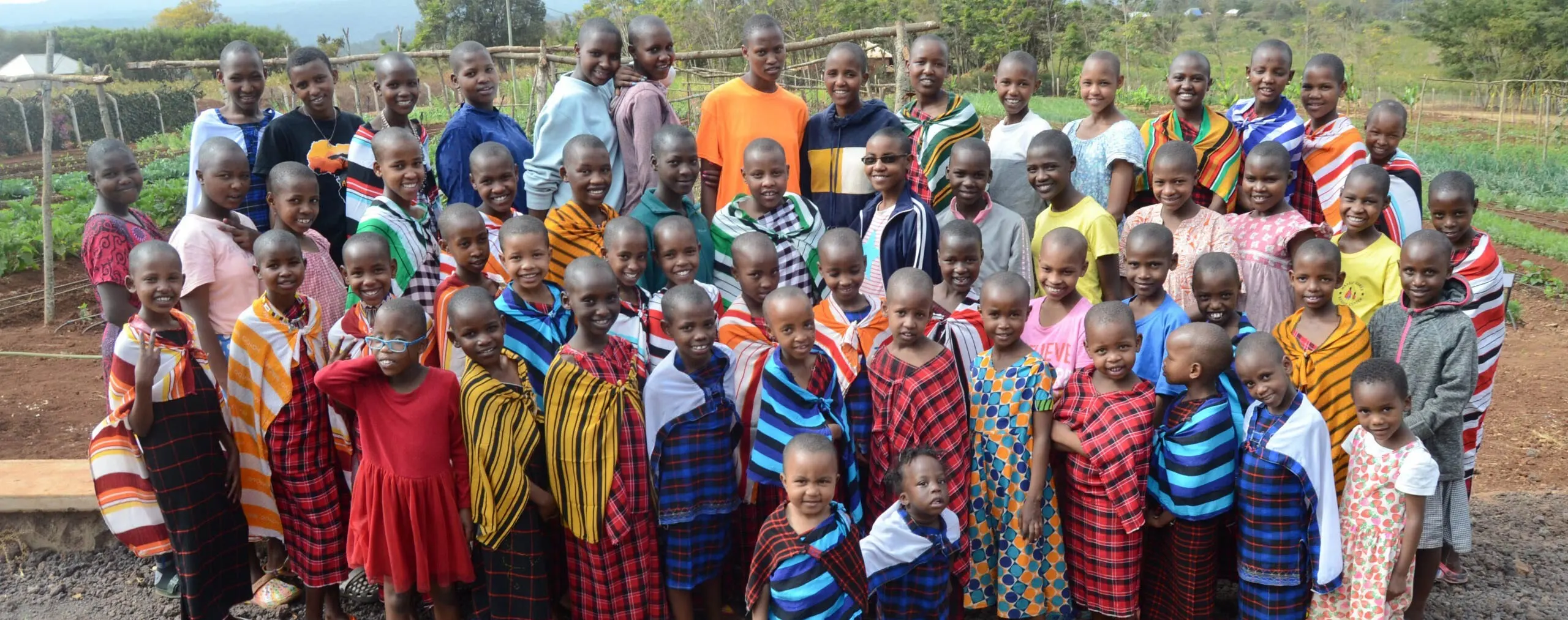 Maasai girls in a group photo on the MGRC ecoFarm in Africa