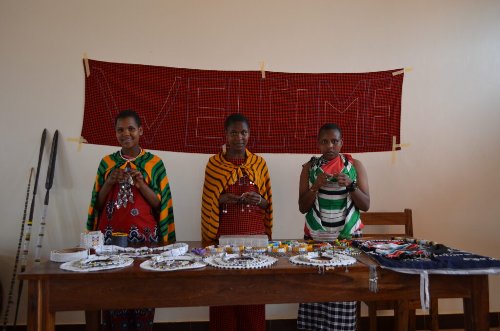 MGRC Girls showcase their Maasai beadwork for visitors while wearing their traditional outfits. (L to R, Esupat, Suzana and Napoi)