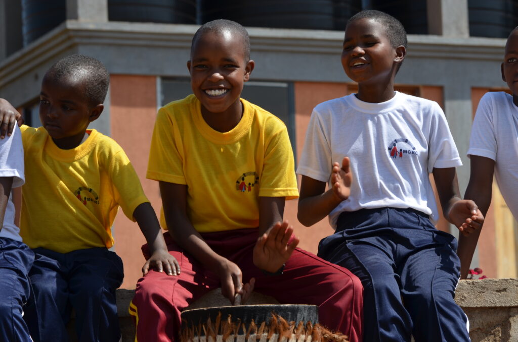 Jael is seen playing one of our homemade drums during the match.