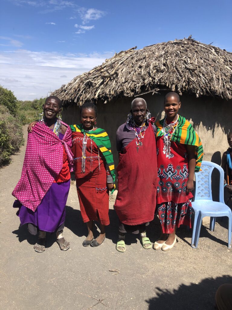 Esupat Saipi, right, with her family and Janeth, second from left, our social worker