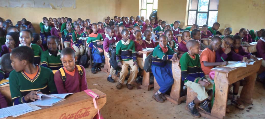 maasai girls sitting at their desks in a classroom