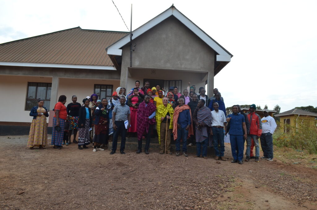 group photo of school officials and mgrc staff in front of the new classrooms project tranforming learning.