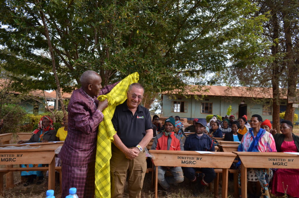 rick morro being honored at a community event by a government official