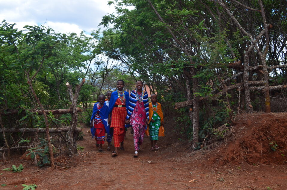 Massai girls walking into the culture center at MGRC ecoLodge