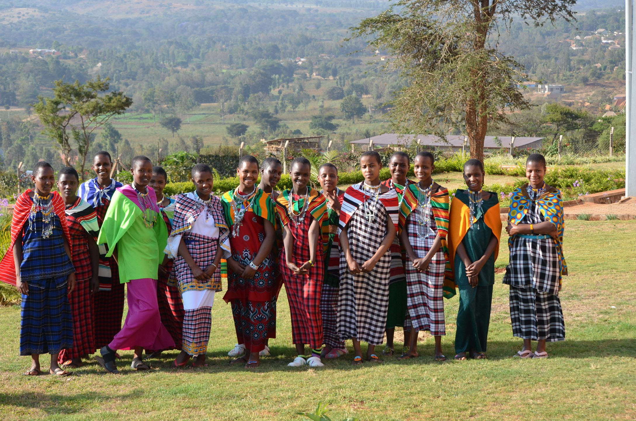 Young Maasai women in a group photo at MGRC ecoVillage