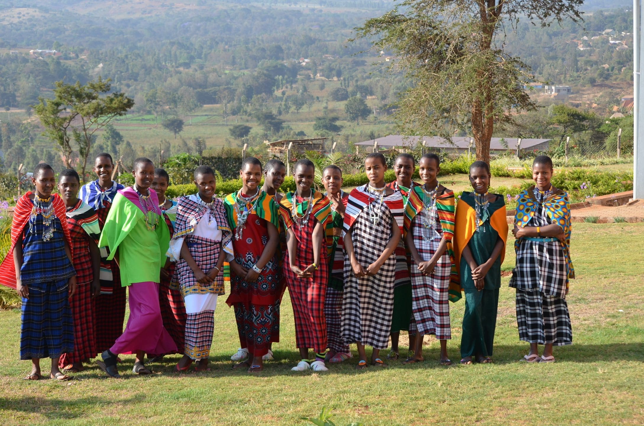 Young Maasai women in a group photo at MGRC ecoVillage