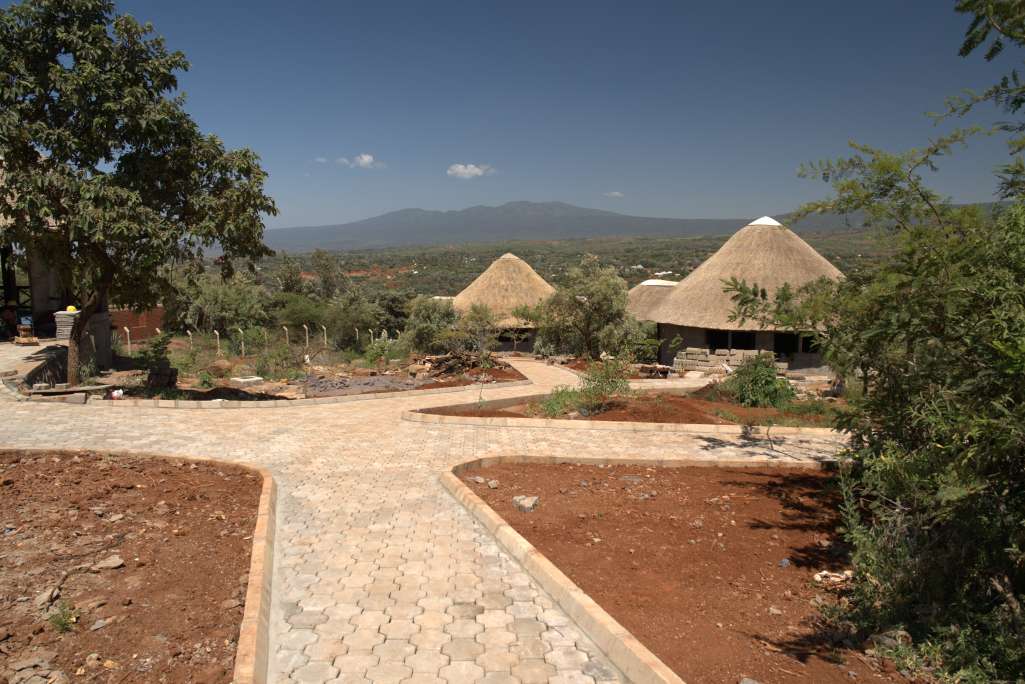 view of the pathways to the ecolodge villas with mountains in the background