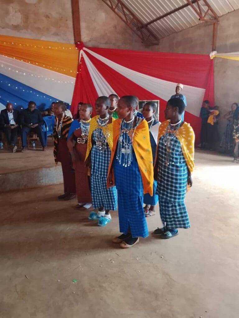 girls celebrating their educational empowerment at a ceremony